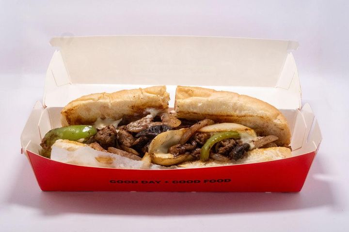 Chimac Cheesesteak: Tender steak with melted cheese, mayo, caramelized onions, mushrooms, and bell peppers.