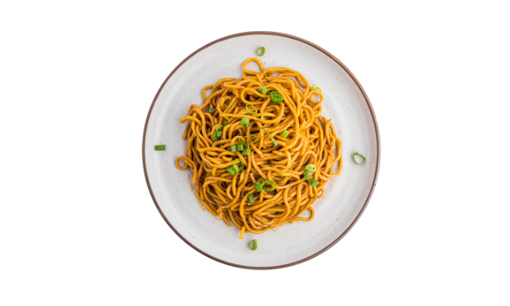 Traditional savory Korean style lo mein noodles served as a flavorful side dish at Chimac.